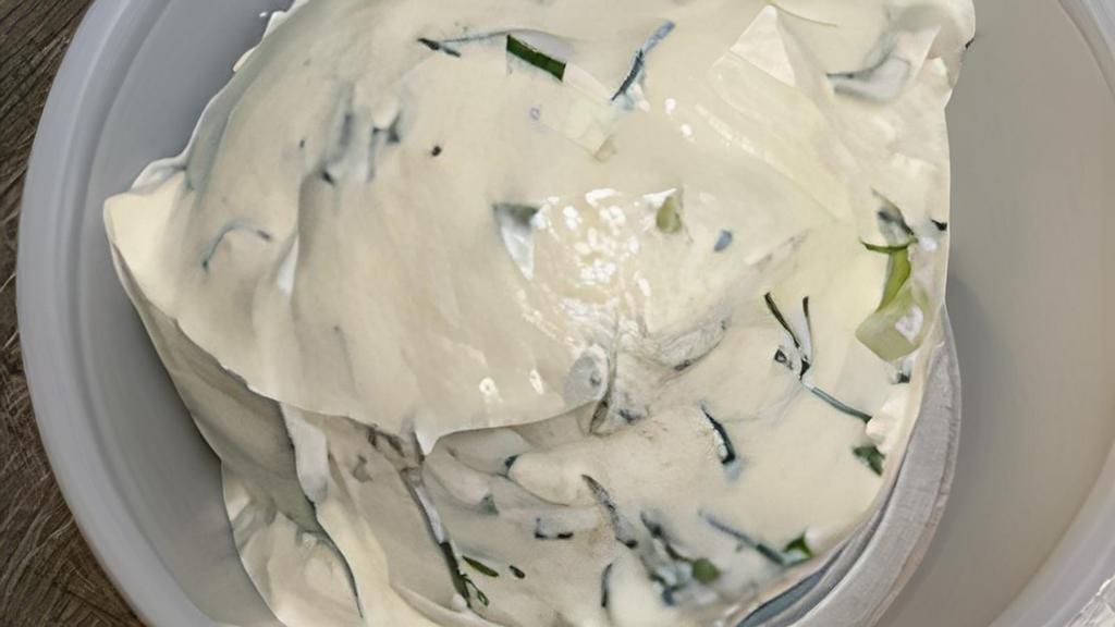 Tzatziki · Greek yogurt, shredded cucumbers, garlic, chopped dill and extra virgin olive oil.