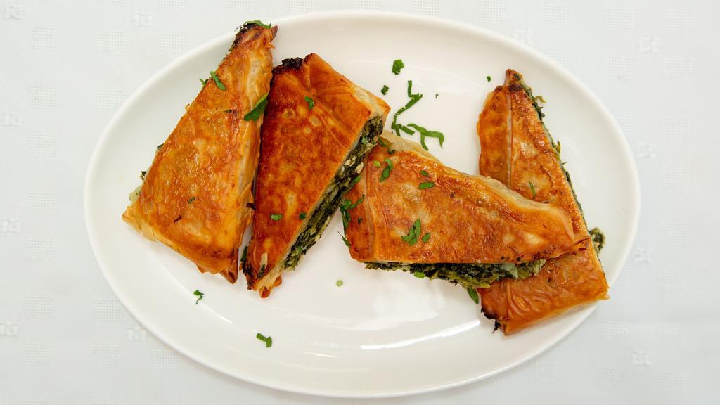 Spanakorizo Lunch · Tomato braised spinach folded with rice.