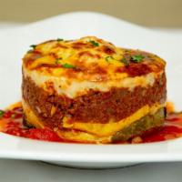 Meat Mousaka Lunch · Layered zucchini, eggplant, potatoes, spiced ground beef, bechamel.