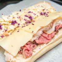 Blonde Bombshell Sandwich · Turkey, roast beef, swiss cheese and coleslaw. Served on a hero.