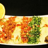 Mixed Mezze Platter · Tabuli, ezme, babaganoush, hummus, grape leaves, bean salad and eggplant in tomato sauce. Se...
