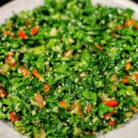 Tabuli · Kisir. Made of tomatoes, finely chopped parsley, mint, bulgur, and scallion, and seasoned wi...