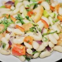 Bean Salad · White beans delightly mixed with chopped tomatoes, parsley and onion. Served with freshly ba...