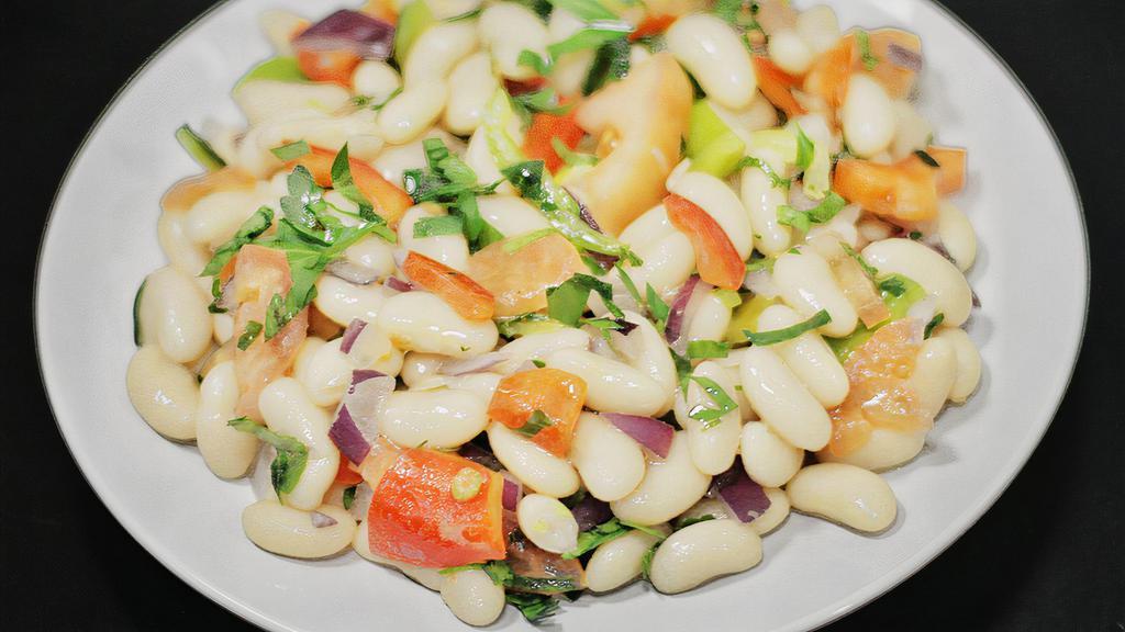 Bean Salad · White beans delightly mixed with chopped tomatoes, parsley and onion. Served with freshly baked bread.
