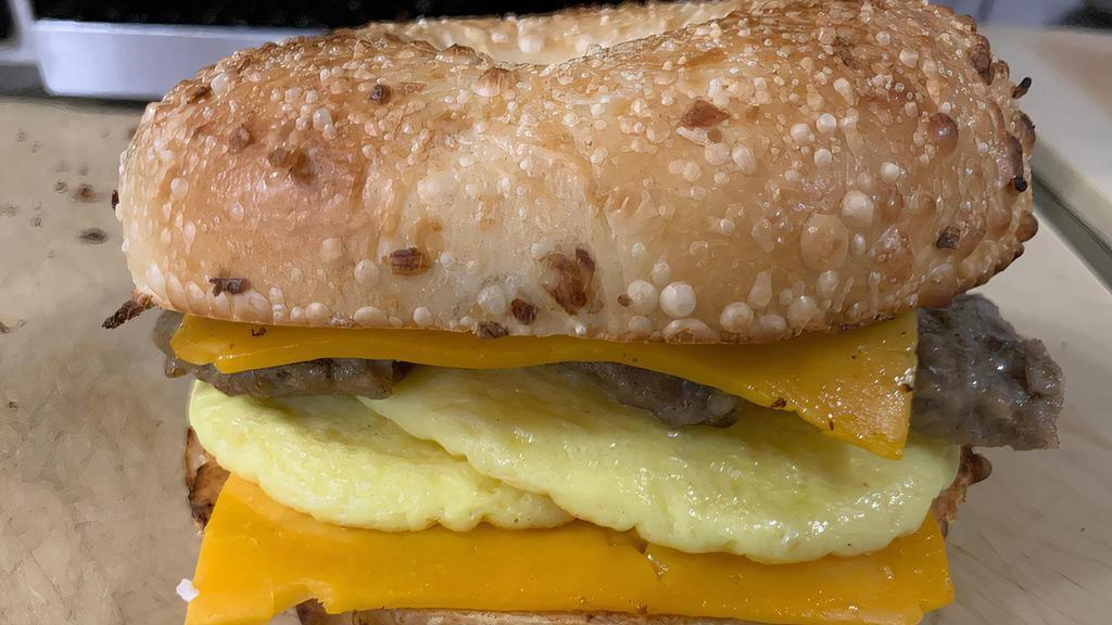 Sausage, Egg, And Cheese · Sausage, scrambled egg patty, and cheddar cheese on choice of bagel