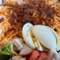 Chicken Cobb Salad · Spring mix, chicken, boiled egg, tomatoes, cucumbers, bacon, and cheddar cheese. Comes with ...