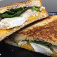 Chipotle Turkey Bacon Panini · Chipotle Ranch, Turkey, Bacon, Cheddar Cheese, Red Onion, and Spinach
