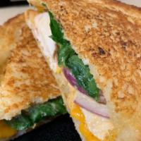 Chicken Bacon Ranch Panini · Chicken, bacon, ranch dressing, cheddar cheese, red onion, and spinach. Comes with chips and...