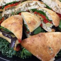 Eggplant With Provolone & Roasted Red Peppers · Eggplant, provolone cheese, spinach, roasted red peppers on ciabatta.
It comes with a choice...