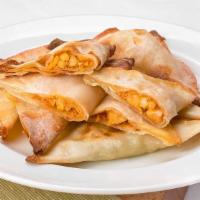 Buffalo Chicken Wontons · This wonton is stuffed with natural white meat chicken that is shredded with your favorite t...