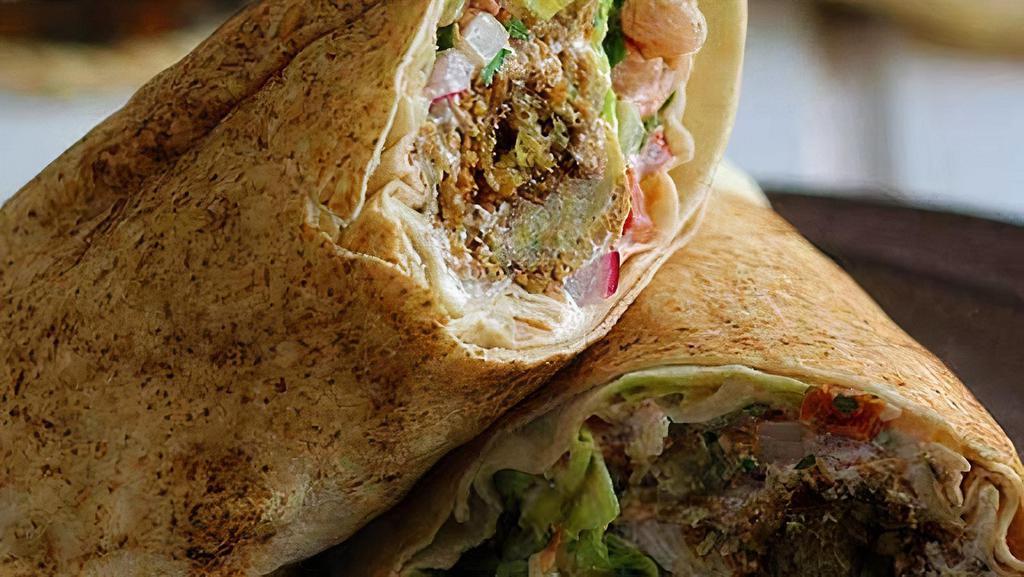 Pw15. Falafel Wrap · Lettuce, cucumber, onion, sweet peppers, and feta cheese with tzatziki sauce.
