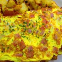 (O2) Meat Lover Omelette With Home Fries On Platter · Two eggs, ham, bacon, sausage, and cheese. Served with home fries and two sliced bread toast...