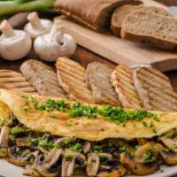 (O6) Mushroom Omelette With Home Fries On  Platter · Three egg whites and mushroom. Served with home fries and Two sliced bread toasted with butt...