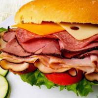 Cold American Combo Sandwich (F1) · Ham, turkey, roast beef, American cheese, lettuce, tomato, and mayonnaise.