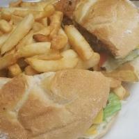 Deluxe Cheeseburger · With lettuce tomato onions and fries.