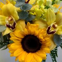 Sunny Jar · A beautiful arrangement in a jar vase with sunflowers, snap dragons and orchids.