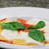 Ravioli Al Forno · Baked cheese ravioli with tomato and basil sauce topped & baked with Parmesan and fresh mozz...