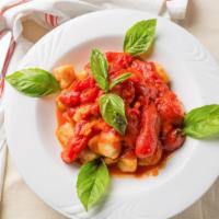 Homemade Gnocchi · Served in a tomato basil sauce.