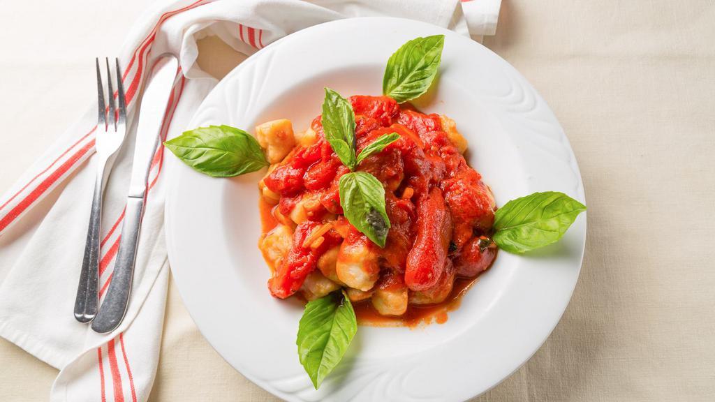 Homemade Gnocchi · Served in a tomato basil sauce.