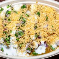 Samosa Chaat · Veggie Samosa Deconstructed with Choole, Yogurt Chutney and Topped with Sev and Onion Cilantro