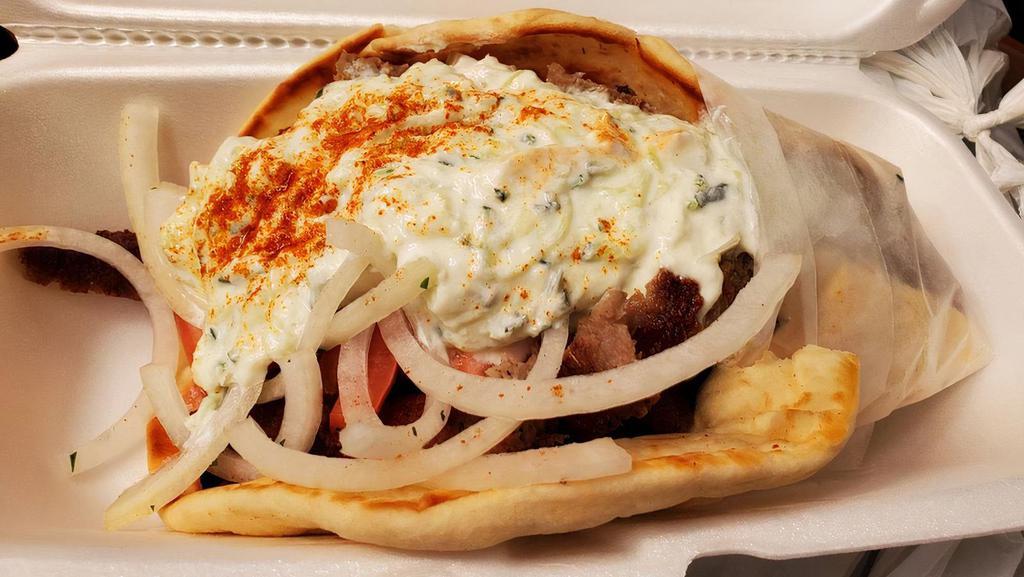 Gyro Special · Gyro meat over greek salad with tzatziki and pita