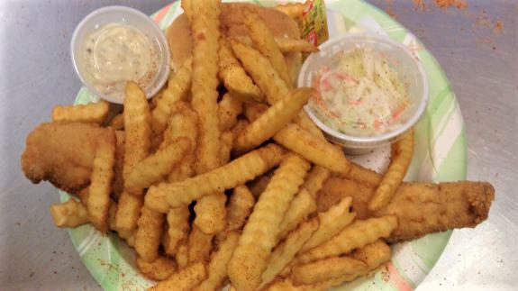 Haddock Dinner · Fresh haddock with seasoned fries, coleslaw and roll.