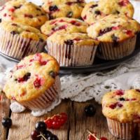 Mixed Berry Muffin · Fresh mixture of berries in fresh muffin.