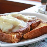 Monte Cristo · French toast with grilled ham and white meat turkey, topped with melted Swiss cheese.
