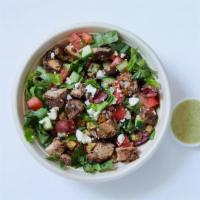 Greek Salad With Chicken · Chopped Romaine, cucumbers and tomatoes, feta, kalamata olives, za’atar croutons and chicken...