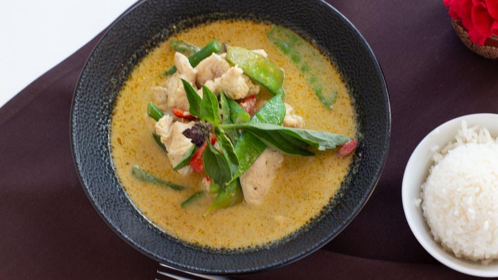 Green Curry · Spicy. Gluten free. With coconut milk, bamboo shoots, basil, and mixed vegetables.