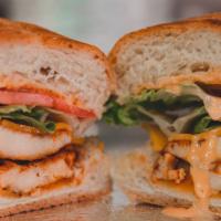 Frangos Sandwich · Chicken breast, lettuce, piri-piri dressing, tomato, and cheddar cheese