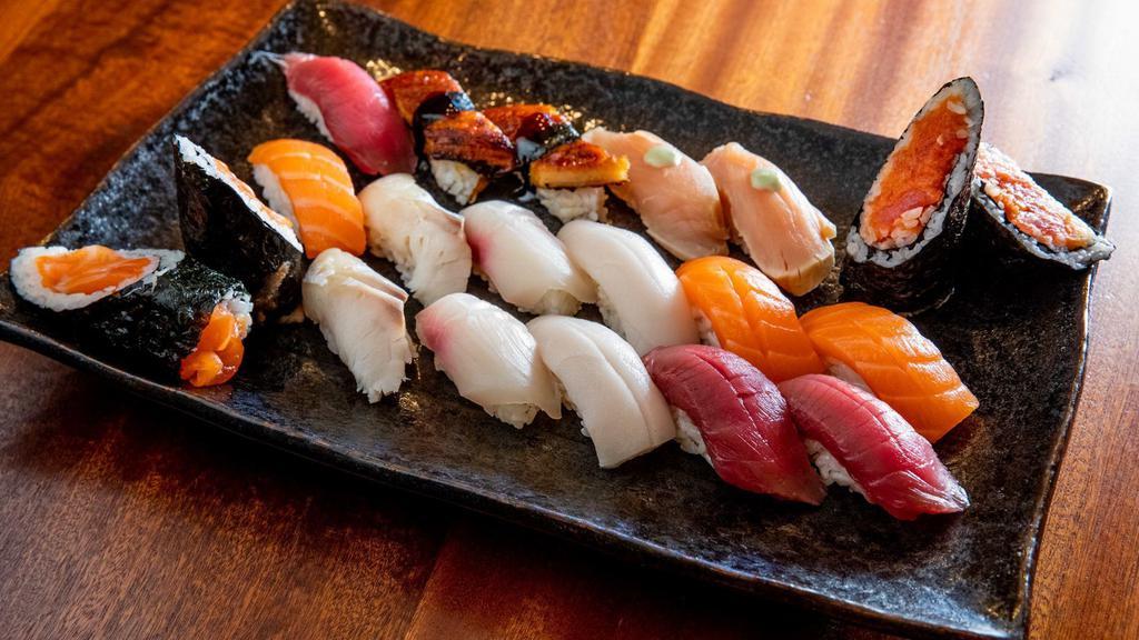 Set B. Edamame · 16 piece sushi and spicy Tuna hand roll Tuna, salmon, eel, Seared Tuna, mackerel, Toro, clam, white Tuna, hamachi, snapper).