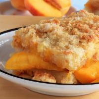 Peace Cobbler · Cinnamon peaches with crumbly butter crust.