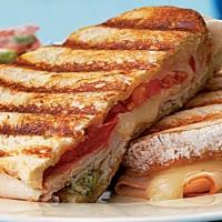 Turkey Panini · Fresh wheat berry bread, turkey, roasted red peppers, apples, dried cranberries, spinach and...
