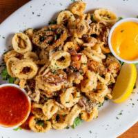 Calamari · Lightly Breaded and Fried with Cherry Peppers served with Marinara and Chipotle Aioli.