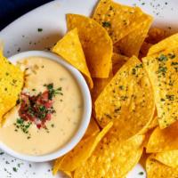 Queso Blanco · New Item. Vegetarian. Creamy White Cheese Dip with Chips.