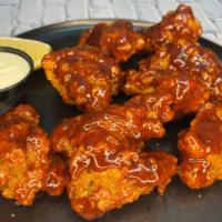 Bbq Chicken Wings · BBQ wings served with blue cheese.