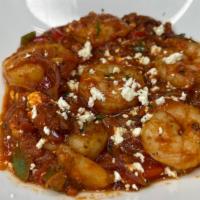 Shrimp Saganaki · Sautéed shrimp with garlic, red onions, peppers, tomato, wine, marinara sauce, and feta chee...