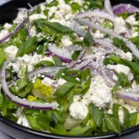 Prasini Salad · Romaine lettuce hearts, red onions, feta cheese, scallions, all tossed together in our Greek...