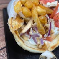 Sparta Chicken Pita · Grilled chicken, fries inside the pita, red onions, tomato, chipotle sauce, and tzatziki.