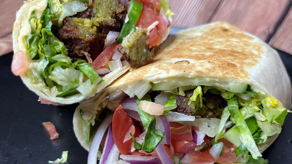 Falafel Wrap · Lettuce, tomato, cucumber, red onions, falafel, served with tzatziki or hummus.