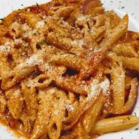 Penne Alla Vodka · Penne pasta tossed with a creamy marinara sauce  and vodka infused, seasoned with fresh herb...