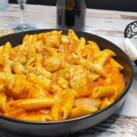 Penne Alla Vodka With Chicken · Penne pasta tossed with a creamy marinara sauce  and vodka infused, seasoned with fresh herb...