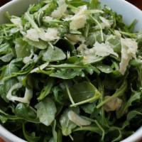 Arugula Salad · Peppery greens in a traditional Italian style salad with fennel, mint, grana and citrus. Glu...
