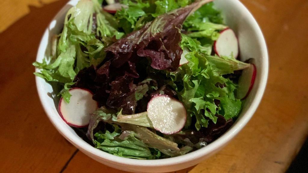 Simple Salad · Mixed greens with shaved radish and chives with red wine vinaigrette.