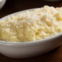 Freshly-Milled Polenta · From Wild Hive Farm, creamy corn polenta finished with Parmesan cheese.