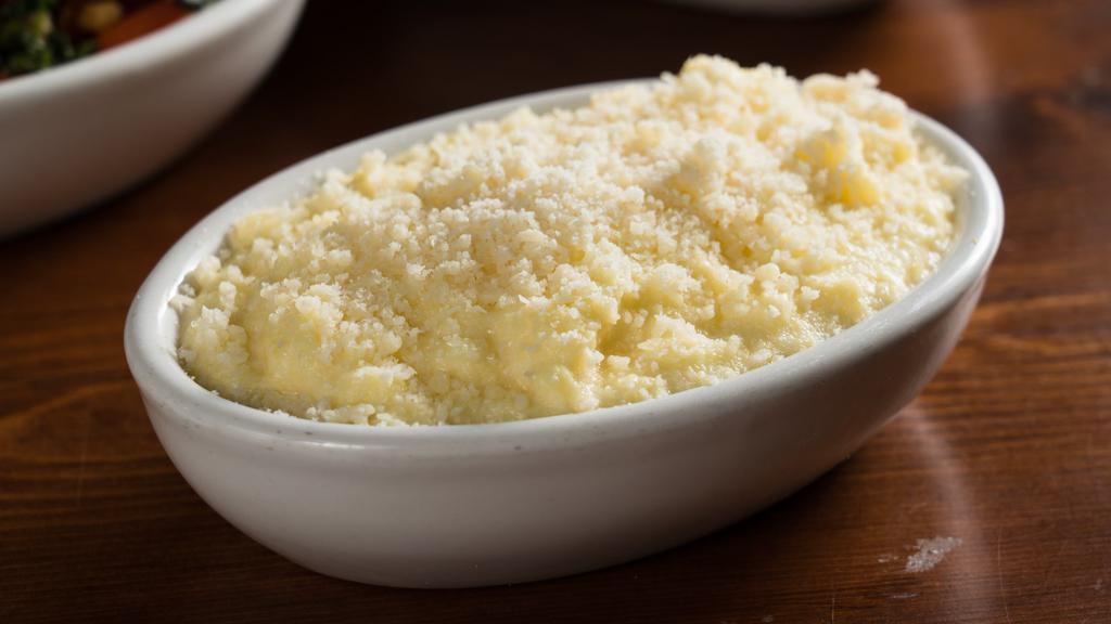 Freshly-Milled Polenta · From Wild Hive Farm, creamy corn polenta finished with Parmesan cheese.