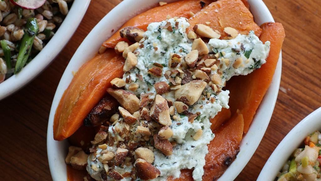 Carrots · Honey roasted carrots, topped with ricotta, mint, parsley and almonds. Gluten free.