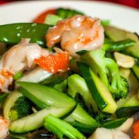 Seafood Delight · Jumbo shrimp, scallop sautéed with assorted vegetables in light white sauce.