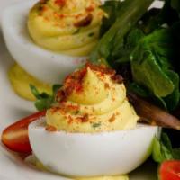 Devilled Eggs · Bacon, Paprika and Mixed Greens.